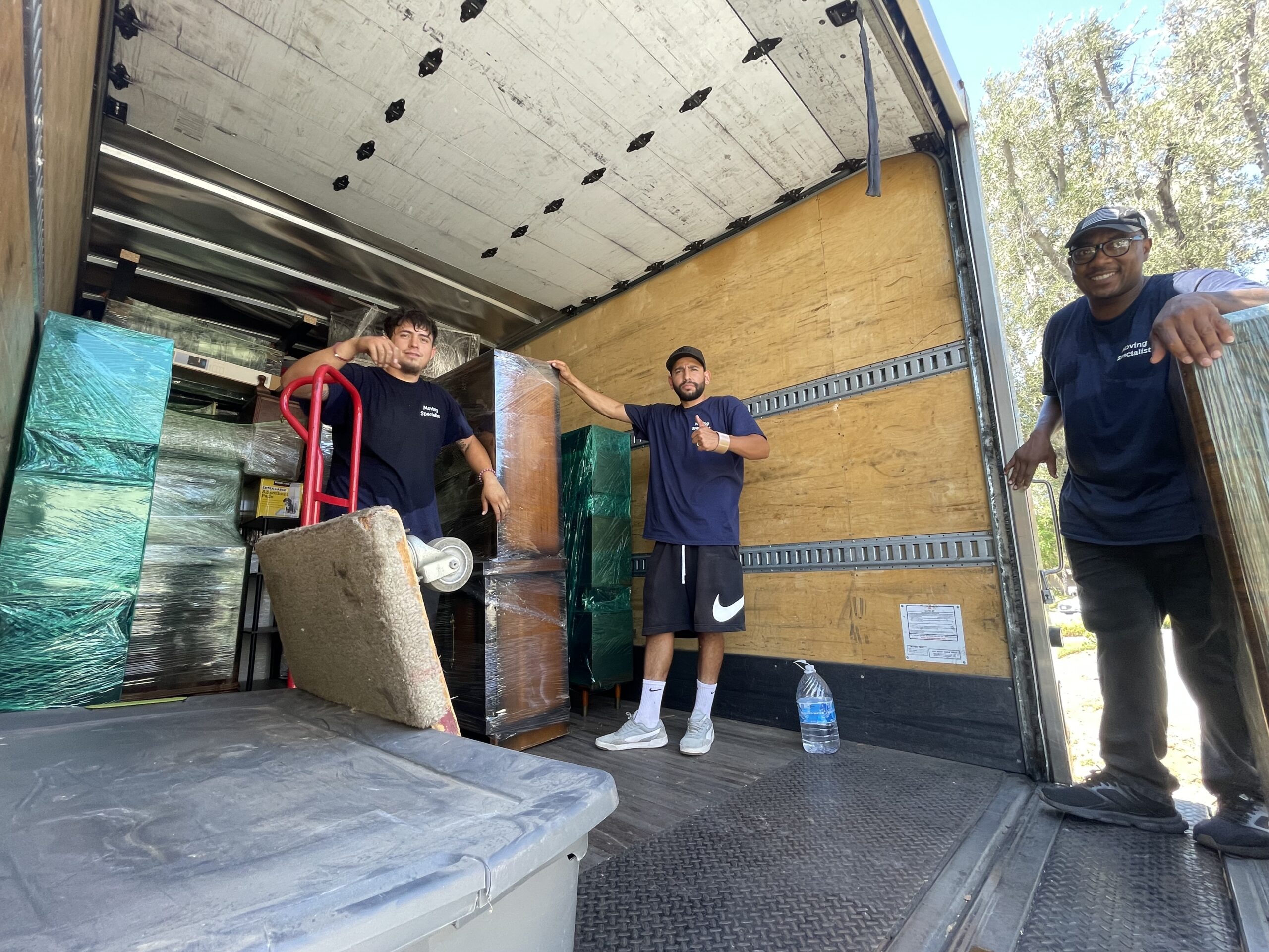 Professional movers in Westminster, CA loading a moving truck for a local and out-of-state relocation