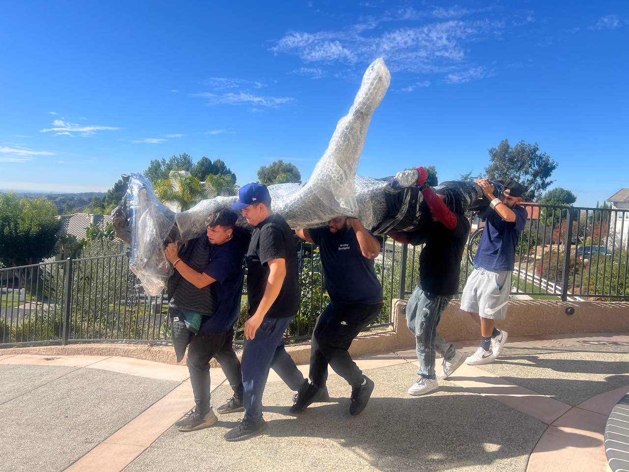 white glove movers handling antique furniture in OC