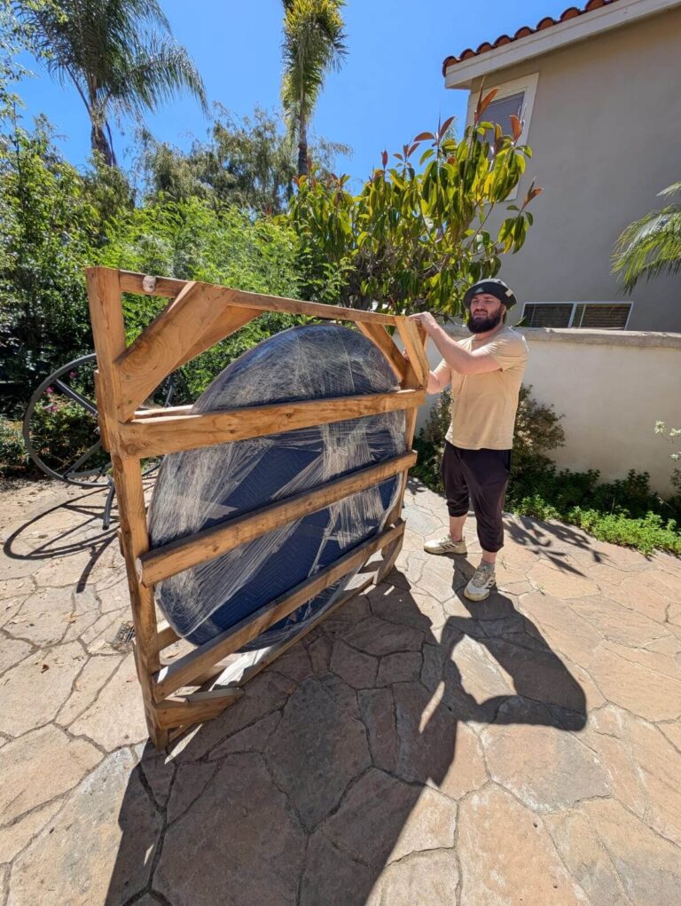 Licensed Westminster movers loading furniture into moving truck