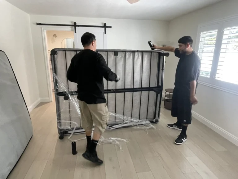 OC Movers team loading furniture for out-of-state relocation