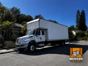 Professional luxury estate movers protecting furniture in Orange County